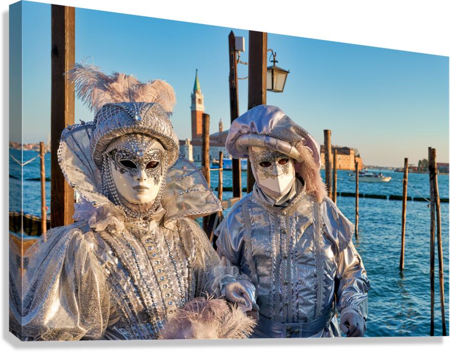 Venice Carnival with silver costumes near water