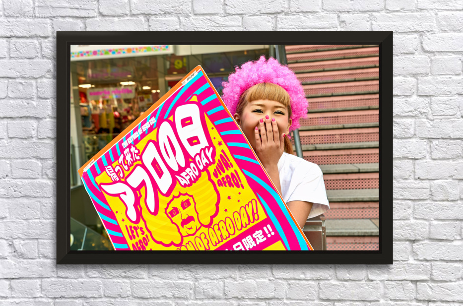 Lolita girl holds sign in Shibuya District of Tokyo during Afro  Deco Frame