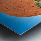 Vast red rock formation under a clear blue sky. Impression metal