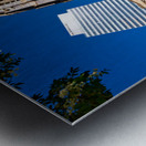 Historic church stands tall next to modern skyscrapers. Metal print