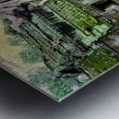 Ancient temple ruins overgrown by massive tree roots and moss. Metal print