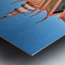 Monk walks through traditional Cambodian temple garden. Metal print