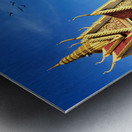 Golden temple green trees and birds under a blue sky. Metal print