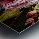 Woman selling raw meat in a bustling market. Metal print