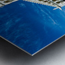 Visitors walk around Pisa Cathedral in Piazza dei Miracoli. The tall structure stands under a blue sky. People enjoy the lively atmosphere. Metal print