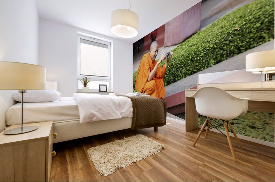 A buddhist monk taking a picture at the National Museum of Cambodia in Phnom Penh Mural print