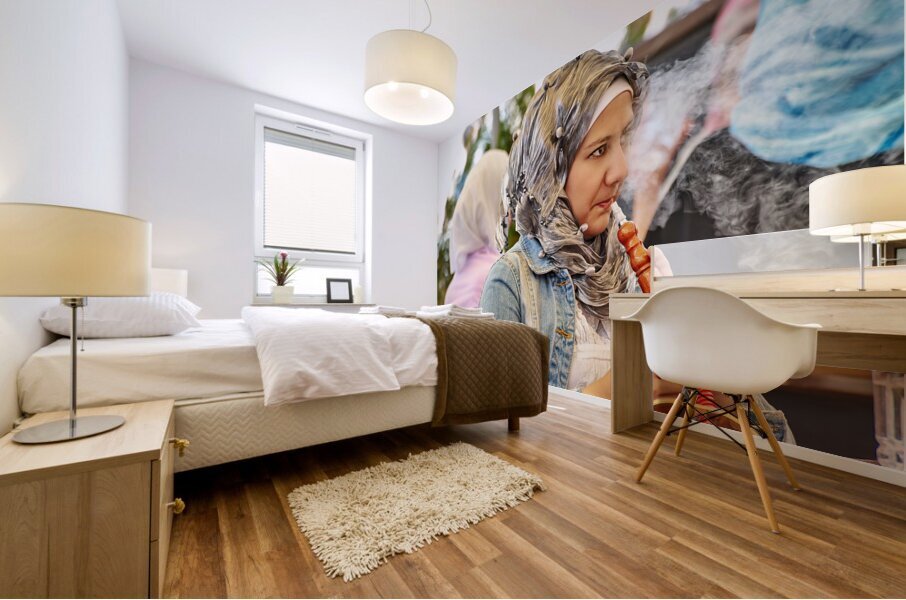 Syria. Aleppo. Girl smoking hookah and looking at her smartphone Mural print