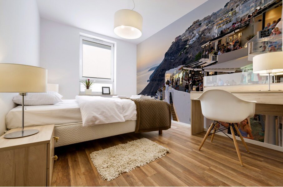 Santorini cliffside town with restaurants and people enjoying th Mural print