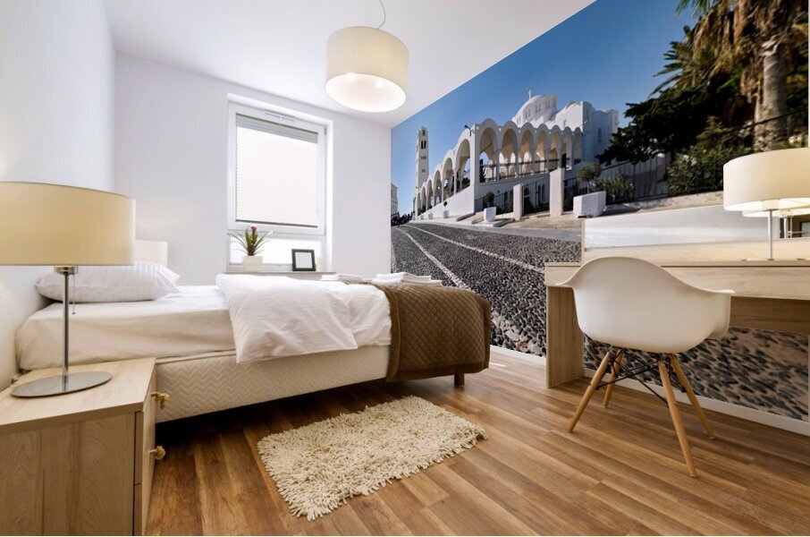 Beautiful white church and cobblestone street in sunny Santorini Mural print