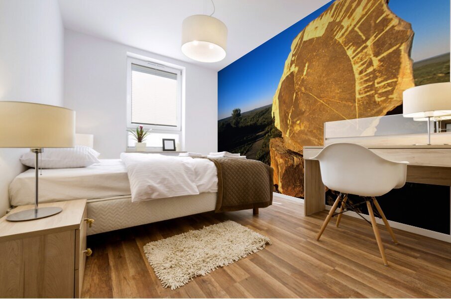 Carved stone monument in the Australian outback at sunset. Mural print