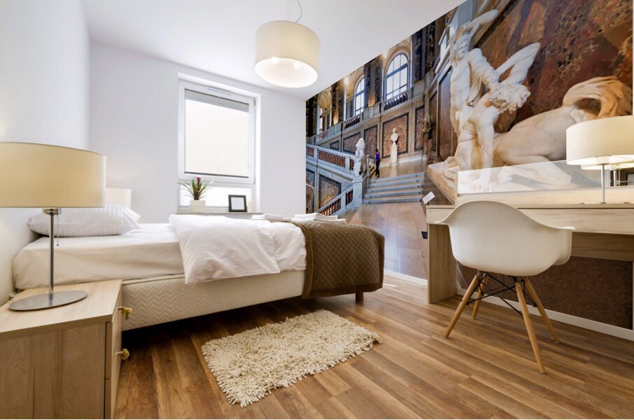 Ornate museum hall with statues grand staircase and visitor. Mural print