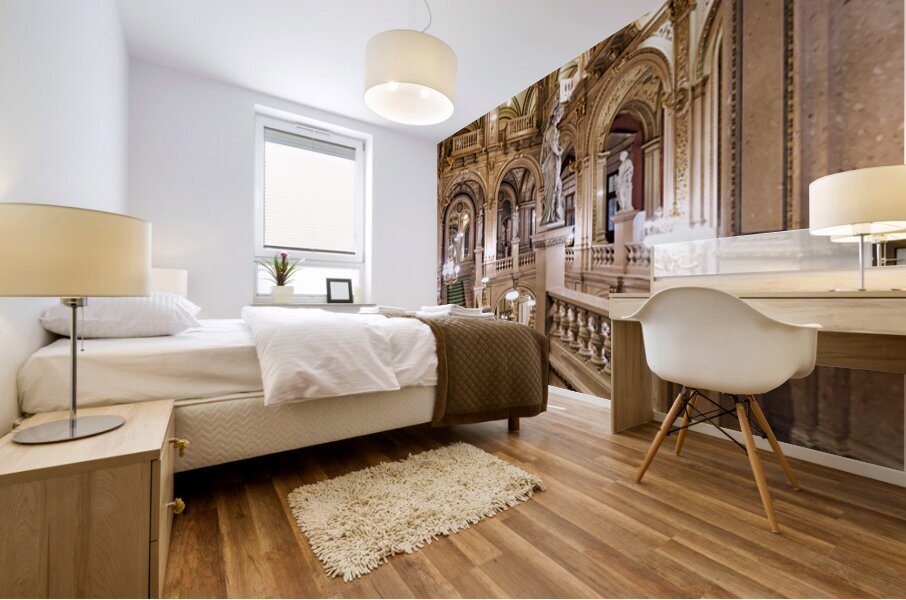 Ornate grand staircase with green carpet and classical statues. Mural print