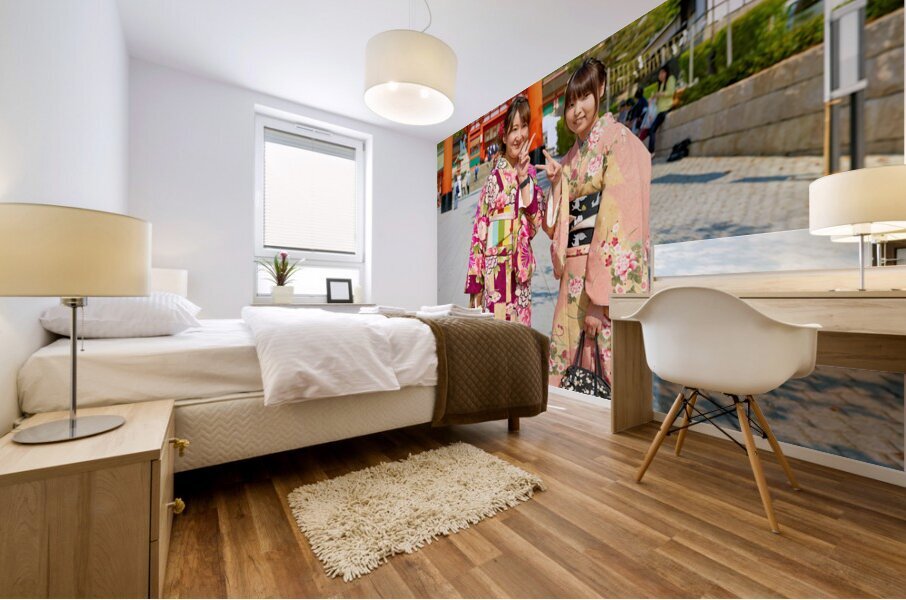 Young women enjoy Fushimi Inari Taisha Shrine in Kyoto Japan Mural print