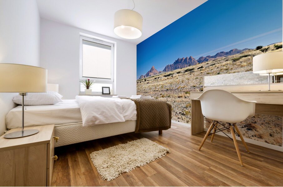 Granite peaks of Spizkoppe rise in Namib Desert landscape Mural print