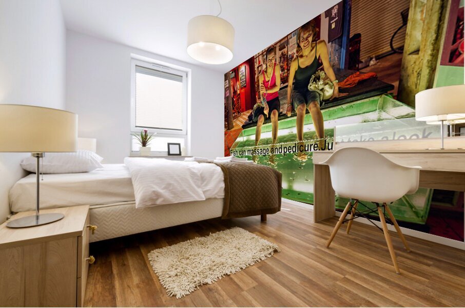 Smiling women enjoy fish foot spa. Mural print