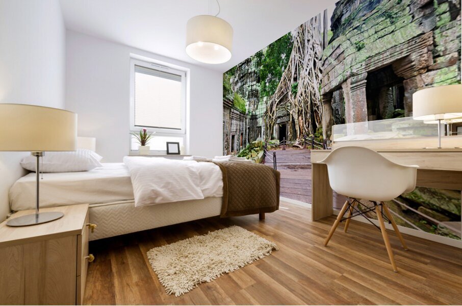 Massive tree roots engulf ancient temple ruins with moss. Mural print