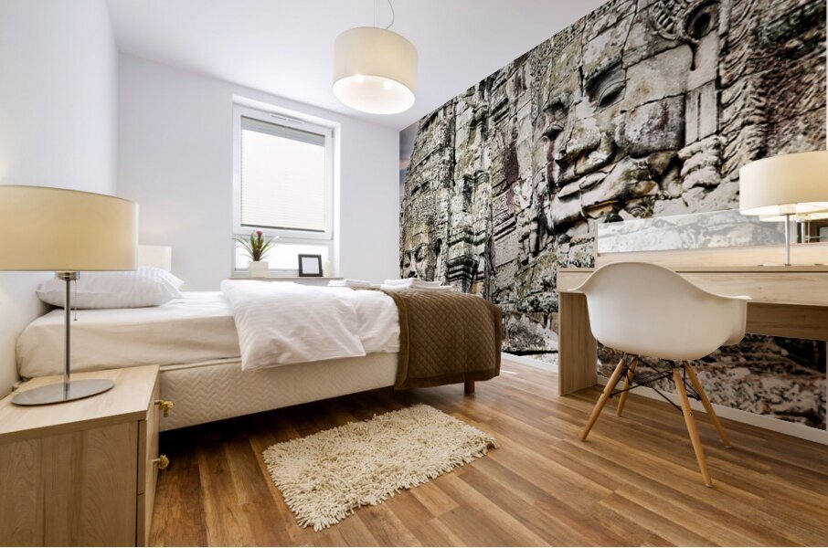 Serene stone faces adorn ancient Cambodian temple. Impression murale