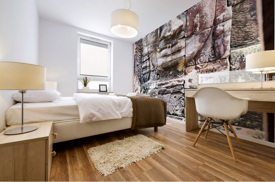 Ancient stone face carving framed in temple window. Mural print