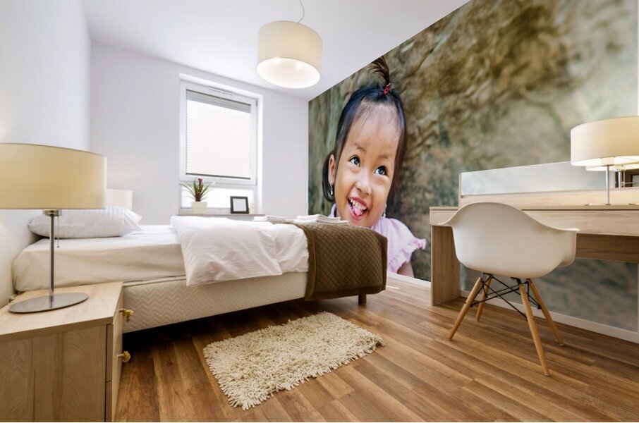 Joyful young girl with a playful smile and tongue out. Mural print