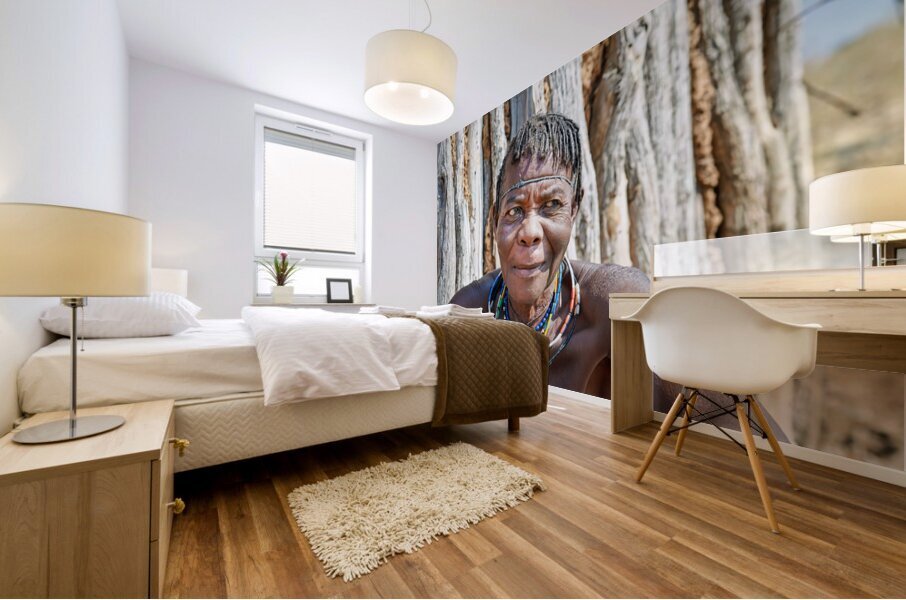 Old woman of Zemba Bantu ethnic group sits near wooden wall in N Mural print