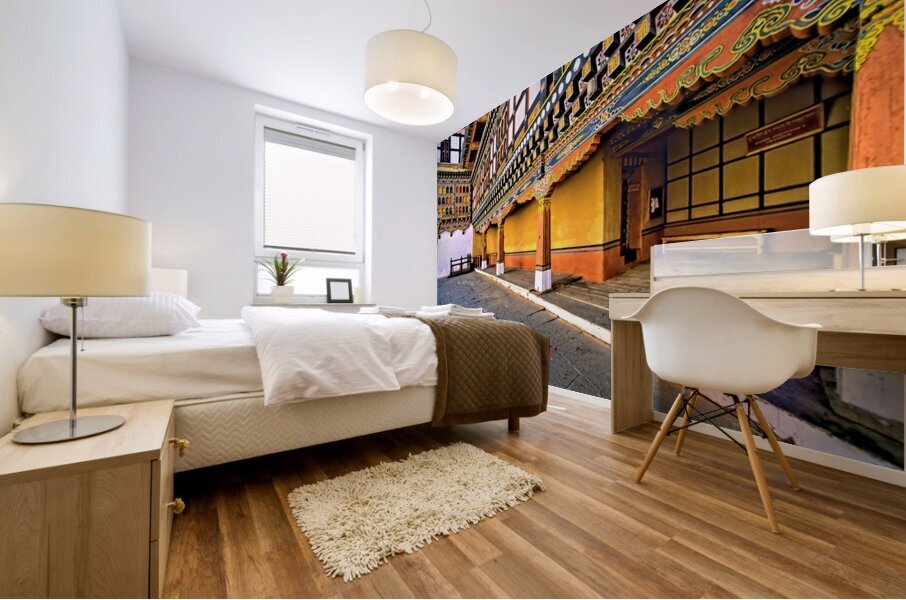 Vibrant ornate Bhutanese temple architecture and stone courtyar Mural print