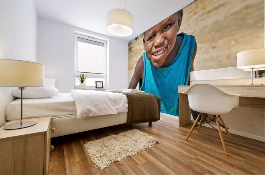 Joyful boy in Kavango Region of Namibia enjoys a moment outside Mural print