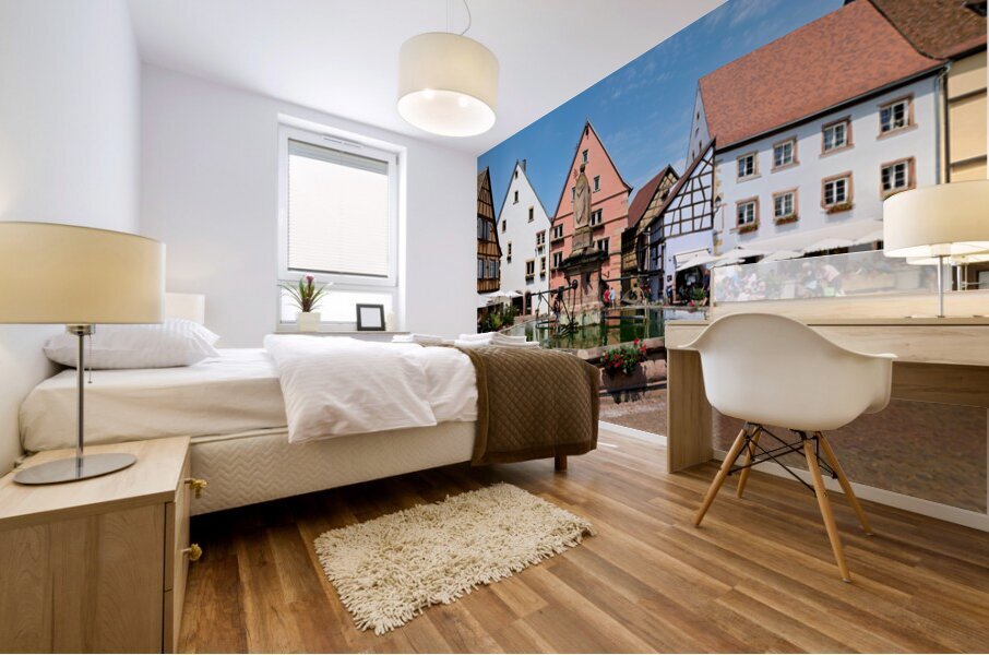 Visitors enjoy Saint Leon square in Eguisheim Alsace on a sunny Mural print