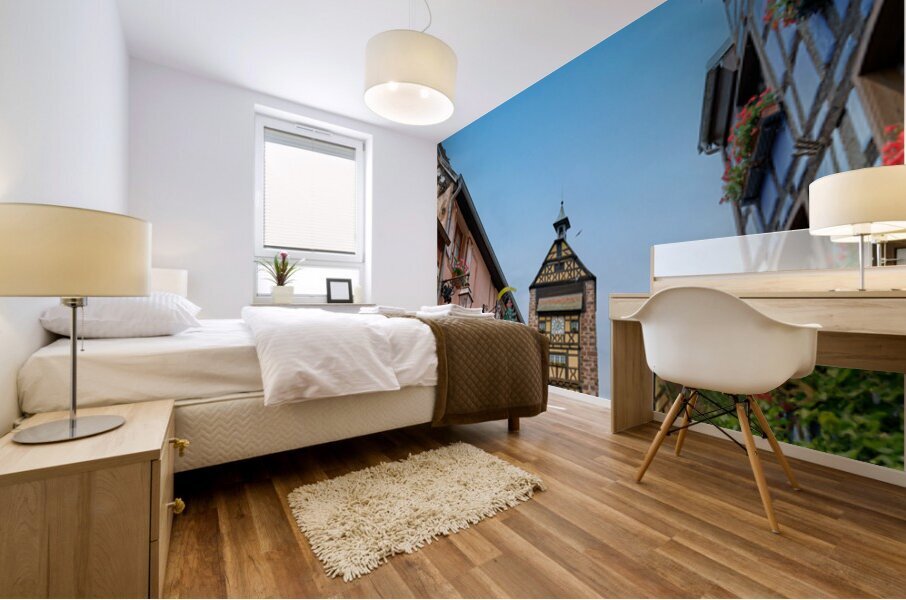 Tourists stroll through historic streets in Riquewihr Alsace Mural print