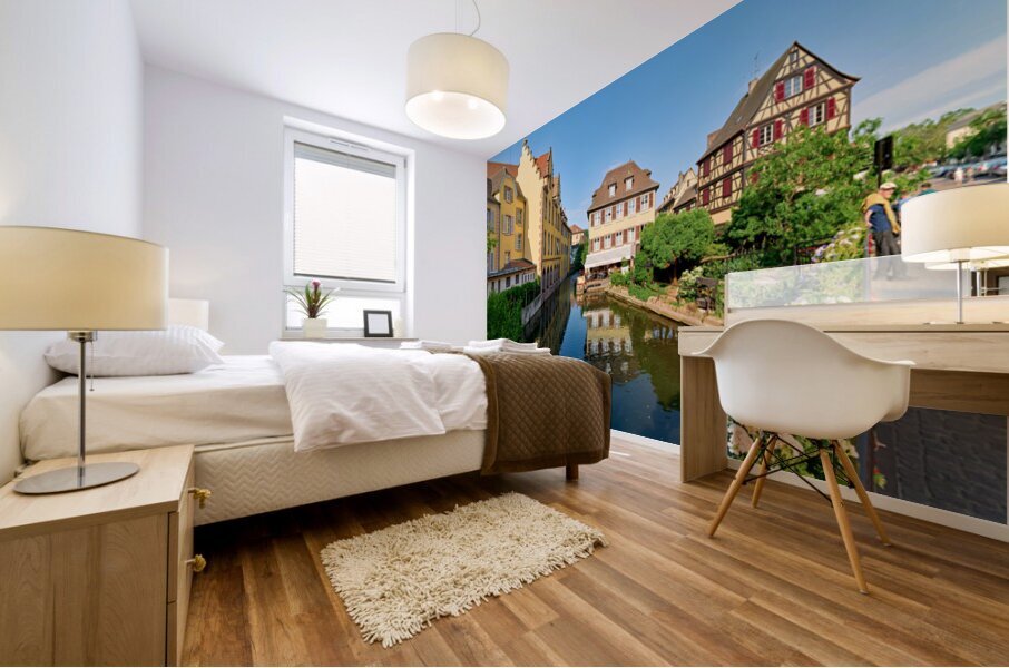 Visitors enjoy sunny day by canals in Colmar France Mural print