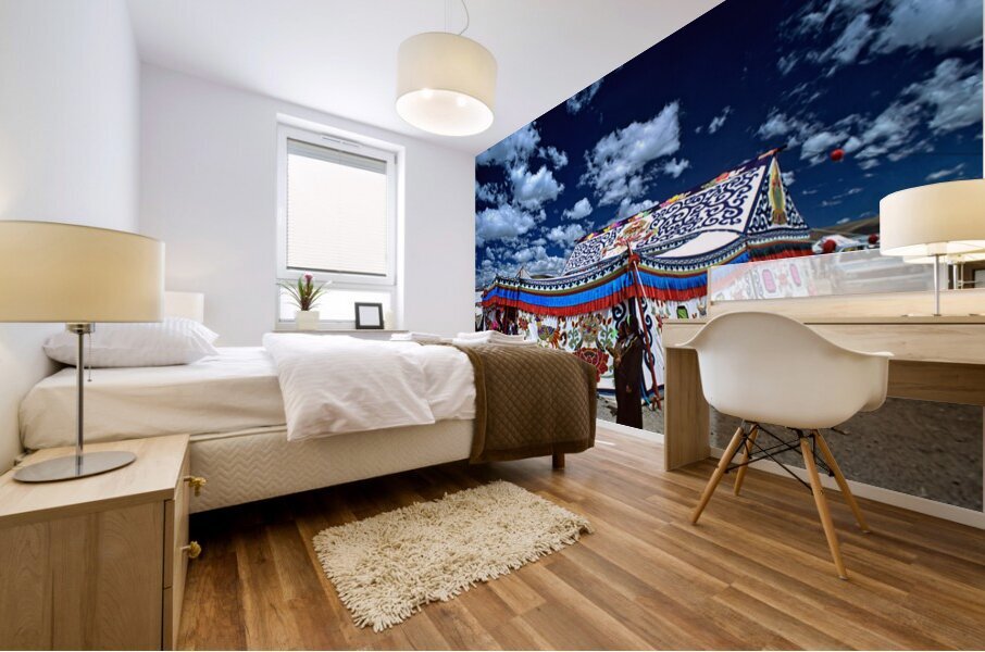 Colorful Tibetan tent with people under a cloudy sky in Tibet Mural print