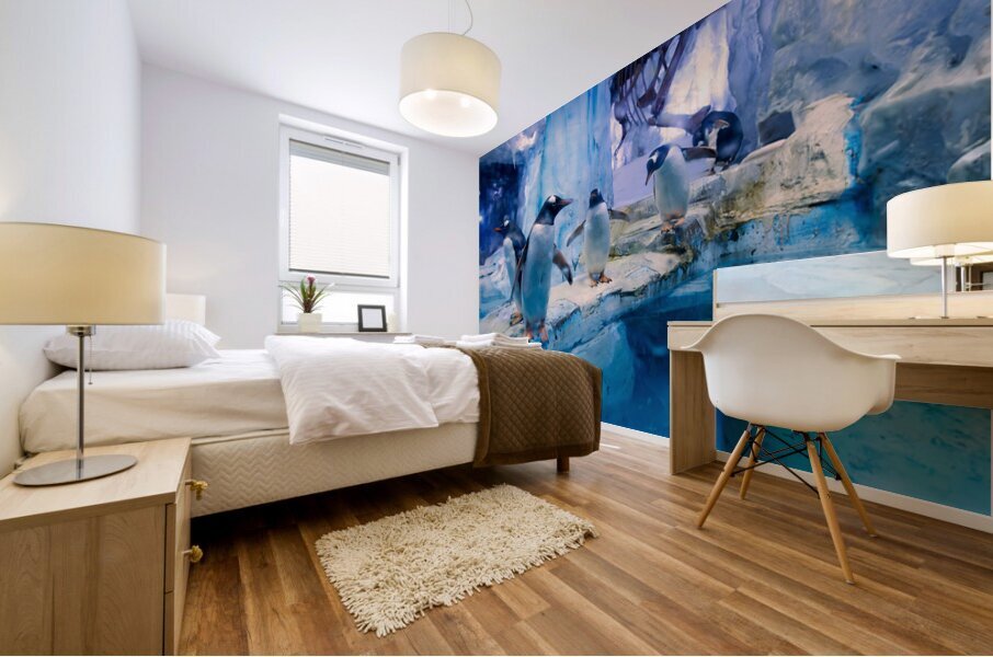 Penguins play on ice near water with a skeleton exhibit in Dubai Mural print