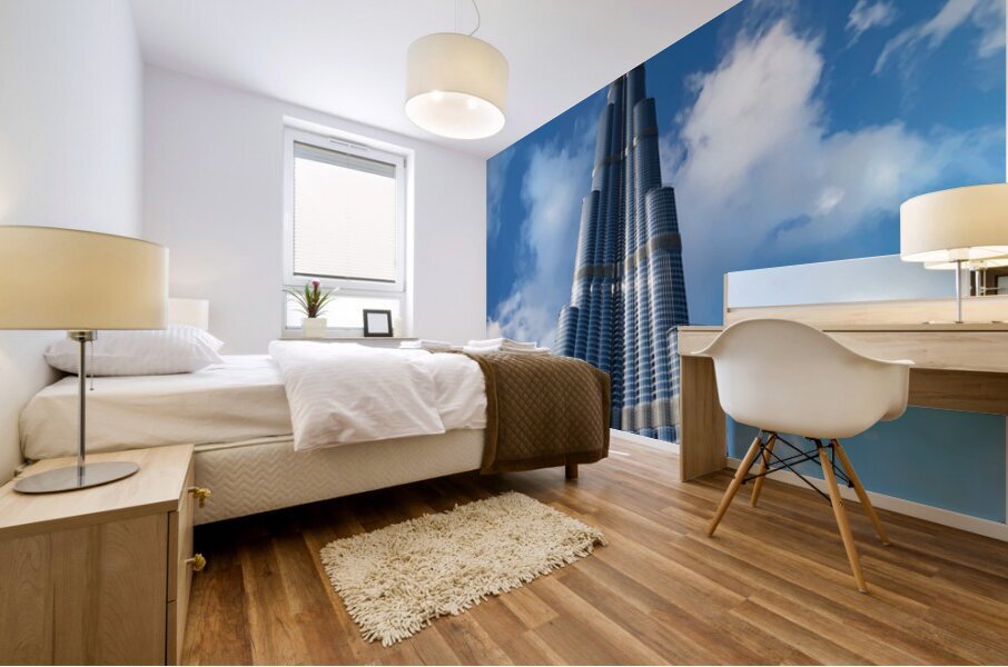 Burj Khalifa stands tall against a blue sky in Dubai UAE Mural print