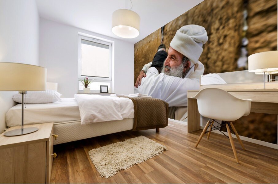 Men embrace each other at the Wailing Wall in Jerusalem Mural print