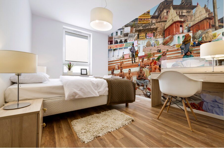 Barechested men offer prayers by the Ganges River in Varanasi Mural print