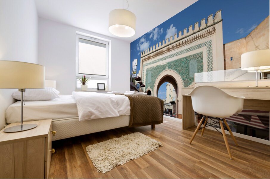 People walk through Bab Bou Jeloud a famous gate in Fez Morocc Mural print