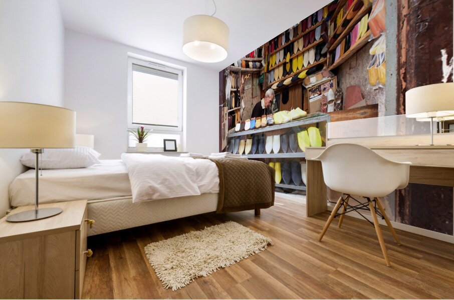 Moroccan babouches shoes in a Fez shop with a vendor Mural print