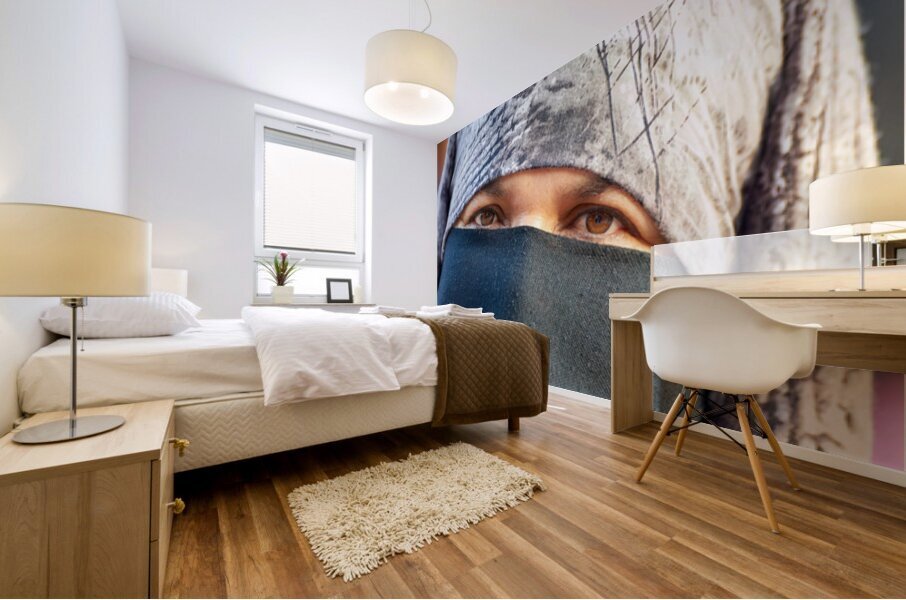 Veiled Moroccan woman in Marrakesh market on a sunny day Impression murale