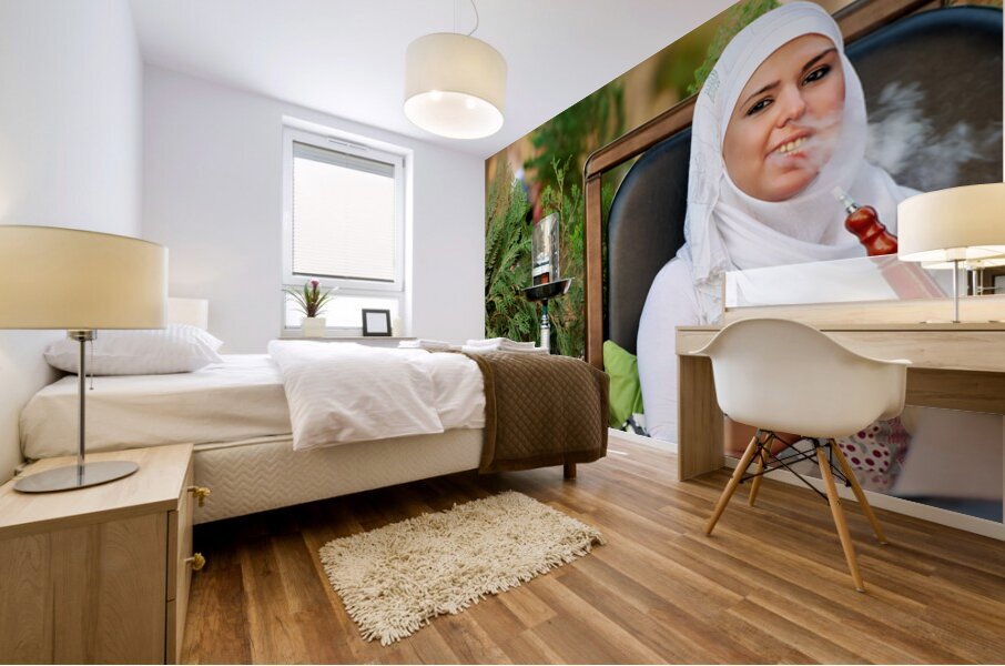 Young woman smokes hookah in outdoor cafe in Aleppo Syria Mural print