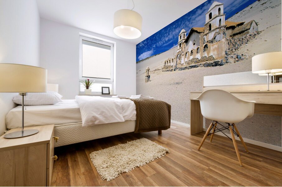 Old church ruins in a desolate sandy landscape. Mural print