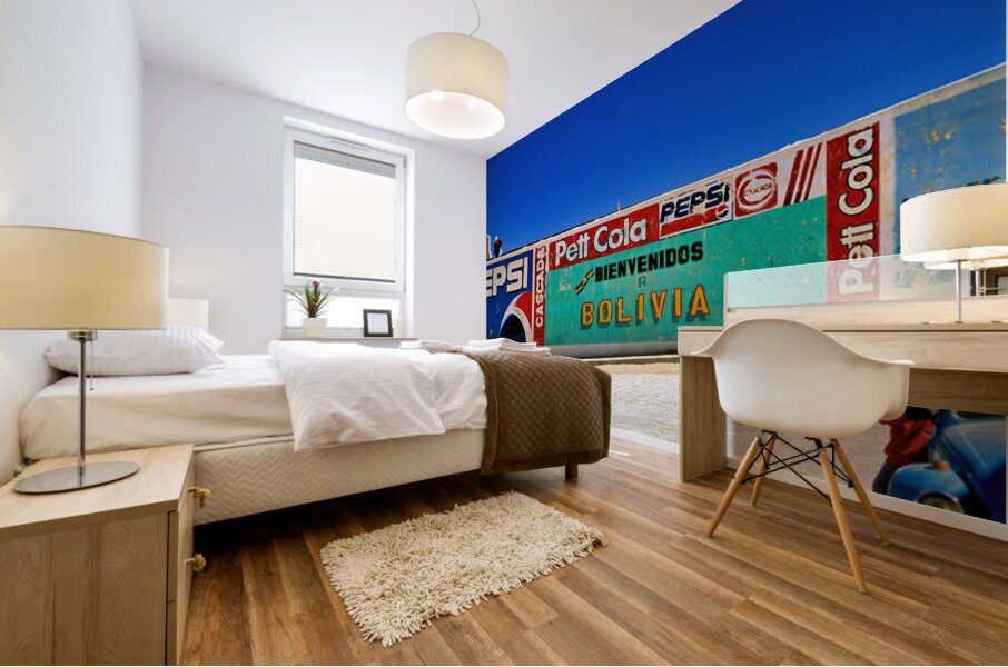 Welcome to Bolivia sign on a wall with old ads. Mural print