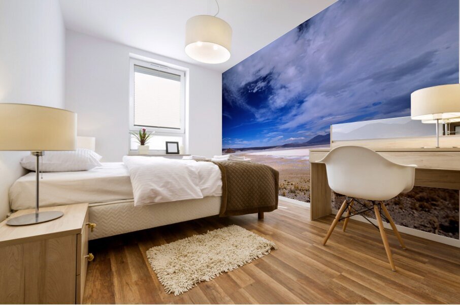 Vehicles traverse a vast arid salt flat landscape. Mural print