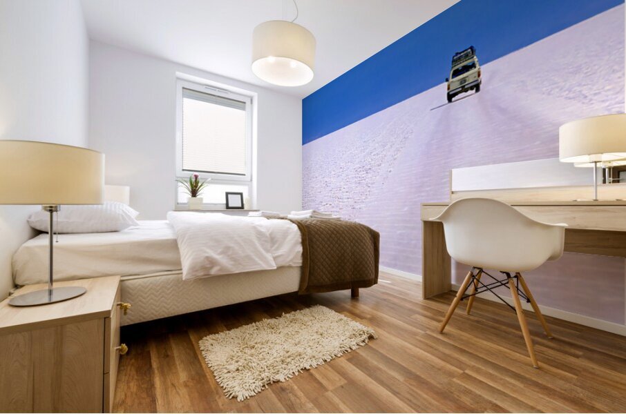 Van driving across vast white salt flat under blue sky. Mural print