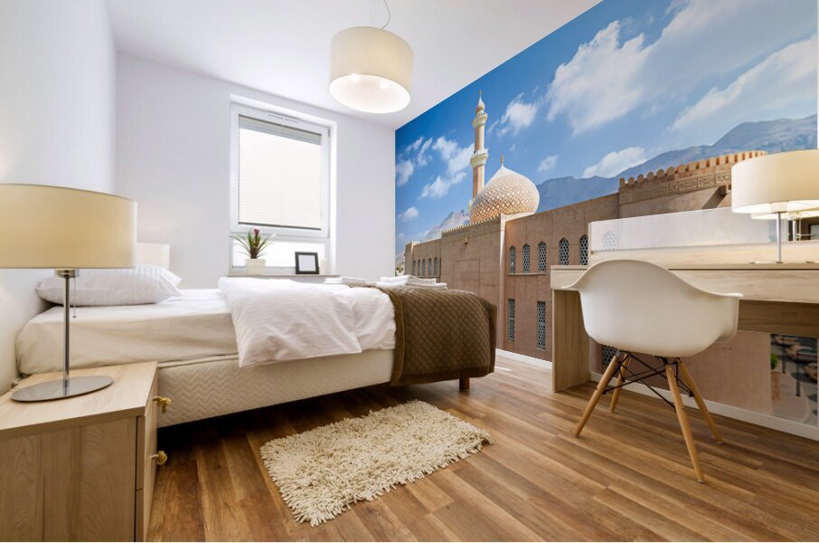 Nizwa Fort view with mountains and clouds in Oman Mural print