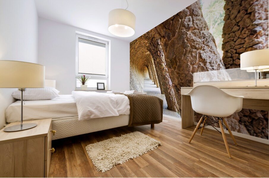 Walking through the colonnaded pathway in Park Guell Barcelona Mural print