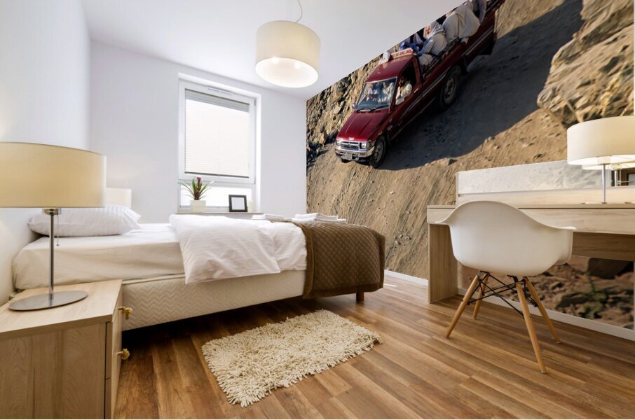 Travelers on gravel road near Shandur Pass in Pakistan Mural print