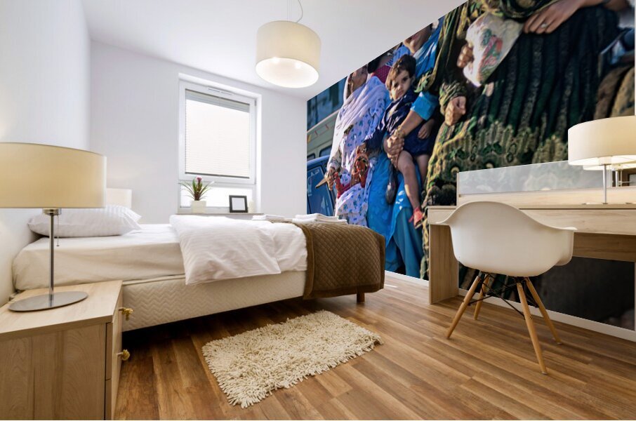 Family travels on rickshaw in busy Lahore streets Mural print