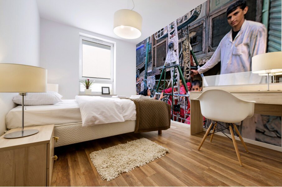 Children enjoy playtime on a swing in Lahore Mural print