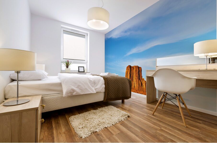 Monument Valley shows red rock formations under blue sky Impression murale