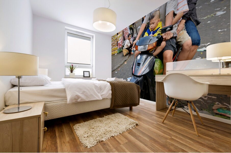 Motorbike family ride through busy Ho Chi Minh street in Vietnam Mural print