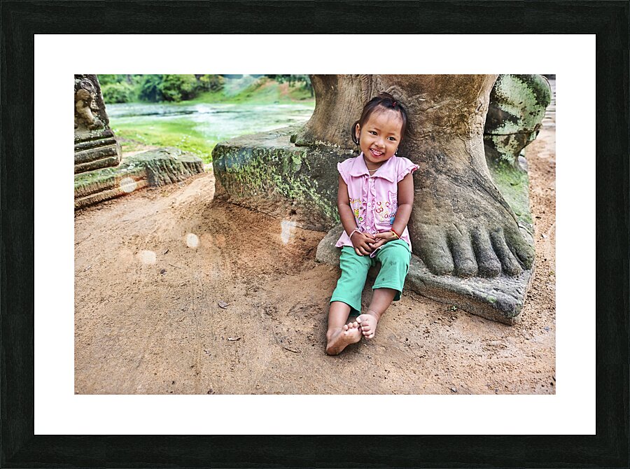 Portrait of a cute child at Preah Khan Temple. Siem Reap. Cambodia Picture Frame print